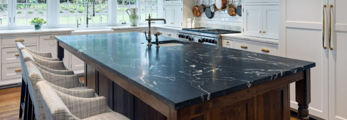 Luxury kitchen with black marble island and white marble countertops