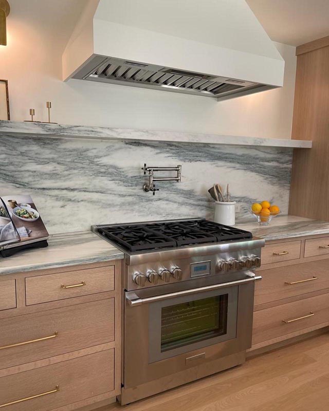 Montclair Danby Marble countertops and matching backsplash with shelf
